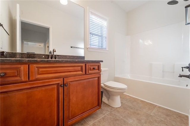 full bathroom featuring toilet, tile patterned floors, bathtub / shower combination, and vanity