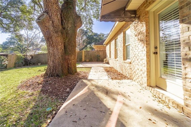 view of yard featuring a patio area and a fenced backyard