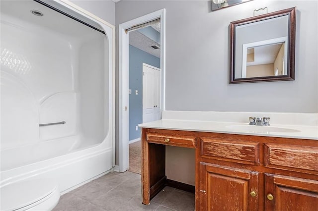 bathroom featuring toilet, visible vents, vanity, tub / shower combination, and tile patterned floors