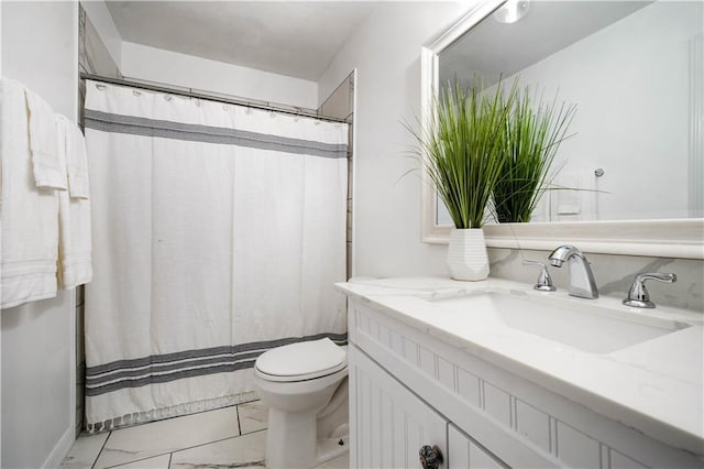 bathroom featuring curtained shower, marble finish floor, vanity, and toilet