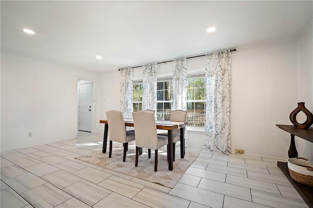 dining area featuring recessed lighting