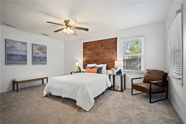 bedroom with light carpet, baseboards, and visible vents