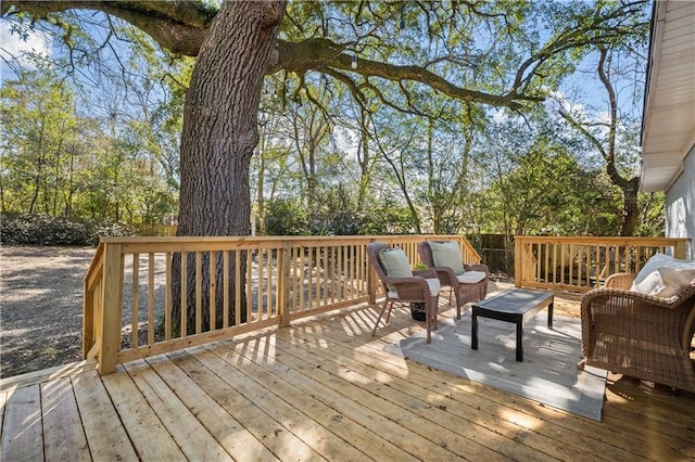 wooden terrace featuring an outdoor living space