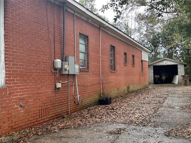 view of property exterior featuring an outbuilding and a garage