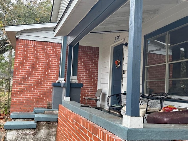 entrance to property featuring a porch