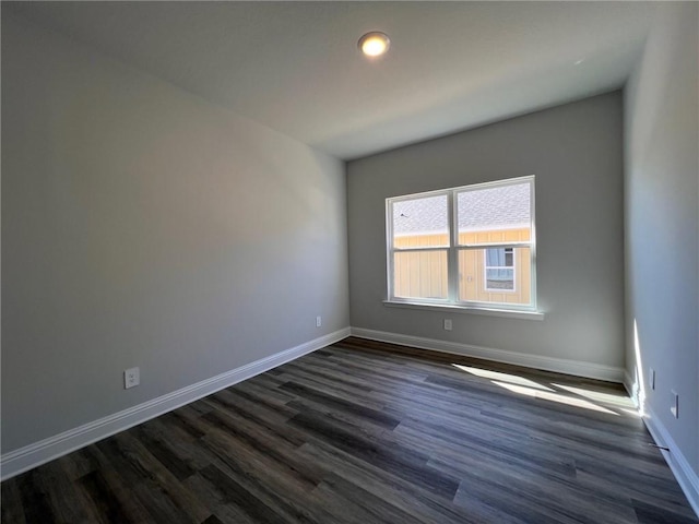 unfurnished room featuring dark hardwood / wood-style floors