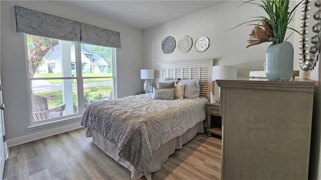 bedroom with wood-type flooring