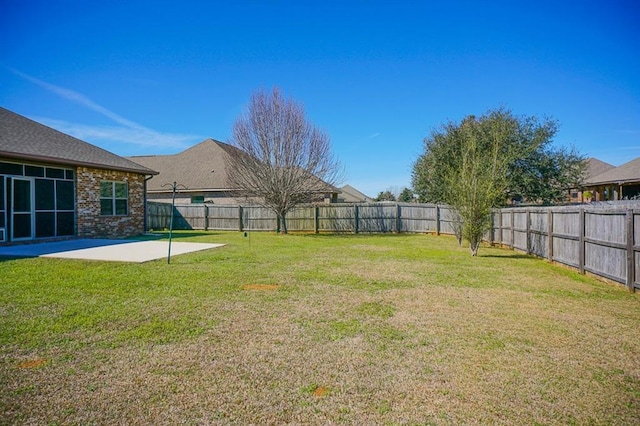 view of yard featuring a patio area and a fenced backyard