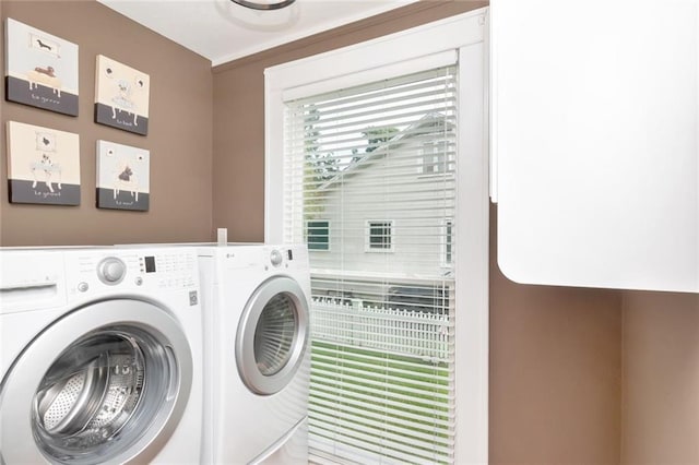 laundry area with washing machine and dryer