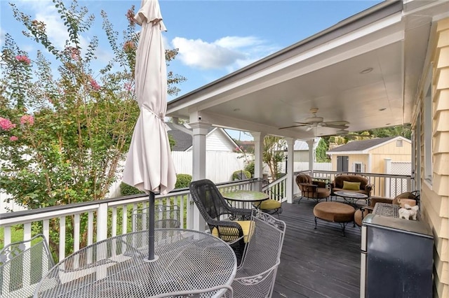 deck with ceiling fan and a storage shed