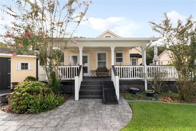 bungalow-style home with a wooden deck