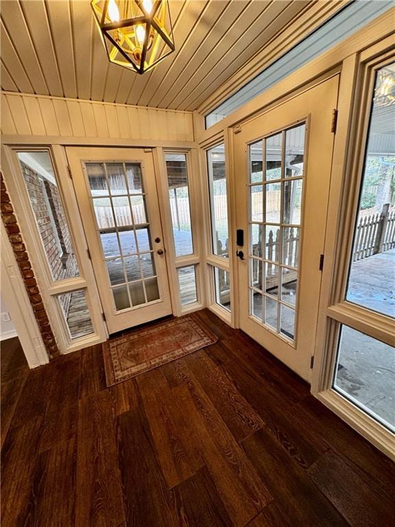 entryway featuring wood ceiling and dark hardwood / wood-style flooring