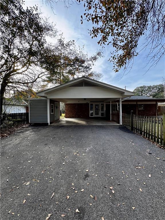 exterior space featuring a carport