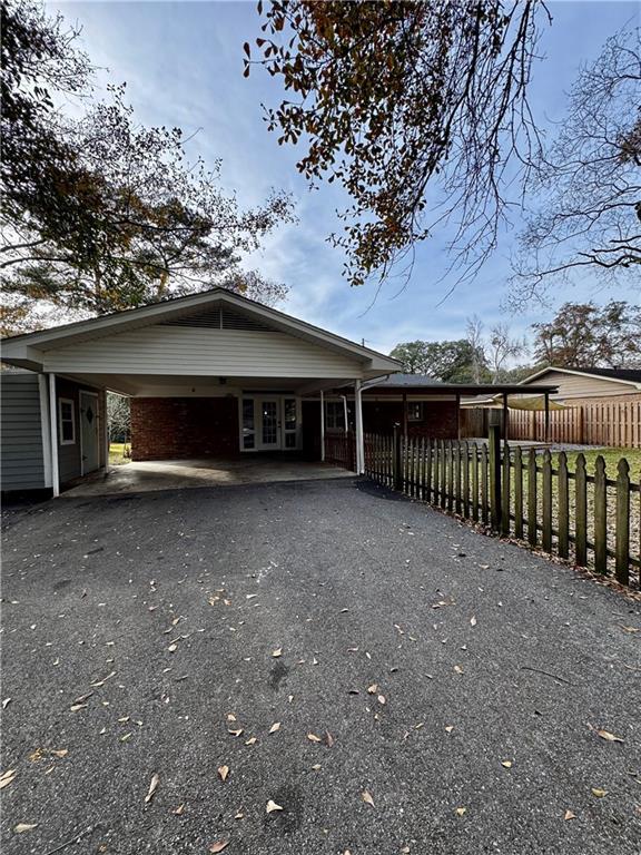 rear view of house with a carport