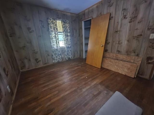 5320 Catherine Dr, Satsuma, AL 36572 - unfurnished bedroom with wood finished floors and wooden walls