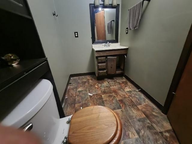 5320 Catherine Dr, Satsuma, AL 36572 - bathroom with stone finish flooring, baseboards, and vanity