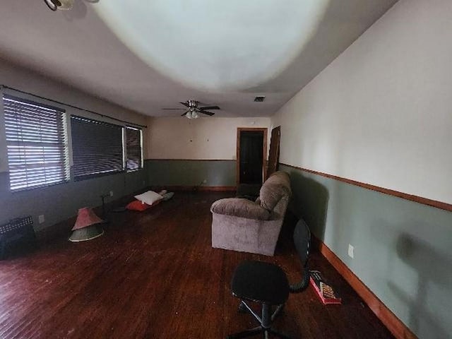 5320 Catherine Dr, Satsuma, AL 36572 - living area with wood finished floors, a ceiling fan, and baseboards