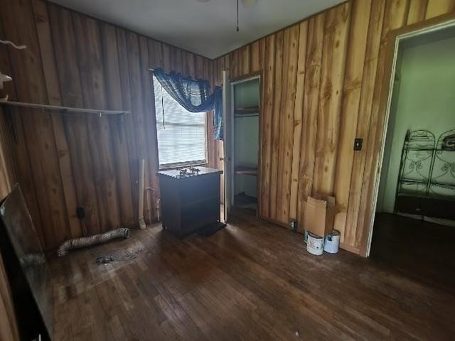 5320 Catherine Dr, Satsuma, AL 36572 - empty room with dark wood-style flooring and wood walls