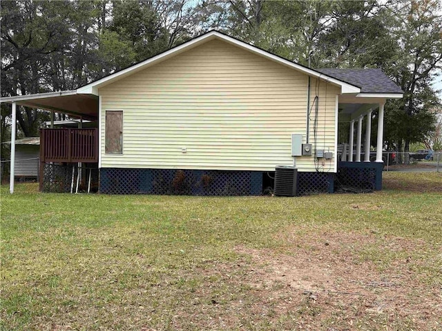 view of property exterior with a yard and central air condition unit