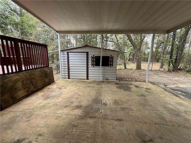 exterior space featuring an outdoor structure, fence, and a shed