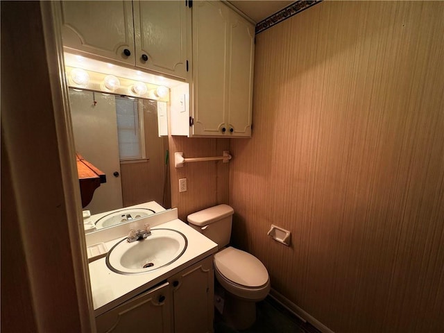 bathroom with toilet and vanity