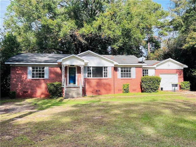 single story home with a front yard and a garage