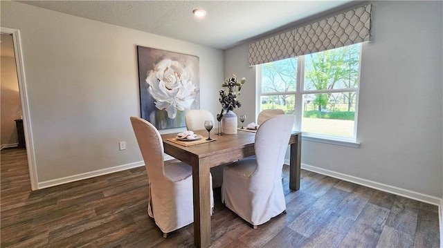 dining room with dark hardwood / wood-style floors