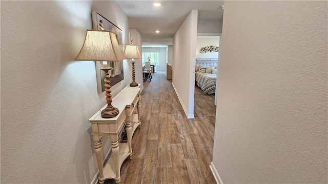 hall with light wood-type flooring