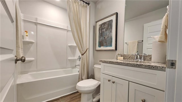 full bathroom with hardwood / wood-style floors, shower / bath combination with curtain, vanity, and toilet