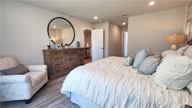 bedroom with hardwood / wood-style floors