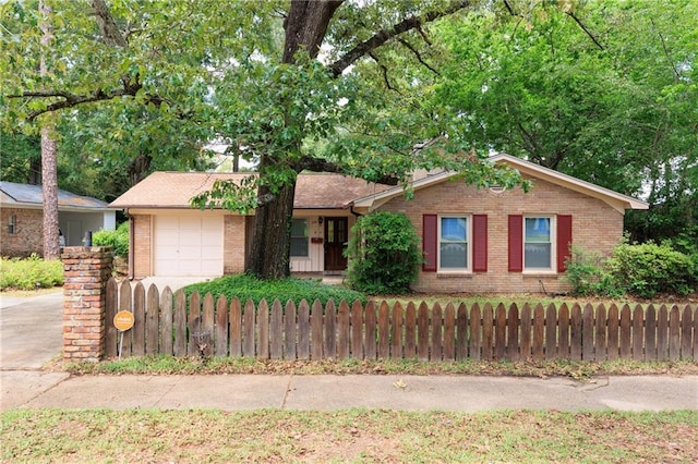 3764 Pleasant Valley Rd, Mobile, AL 36609 - ranch-style home featuring brick siding, an attached garage, fence, and driveway