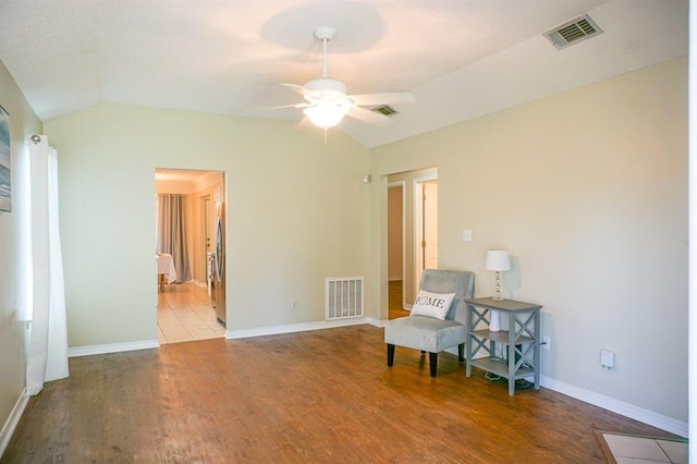 8470 Desert Oak Ct, Mobile, AL 36695 - living area featuring lofted ceiling, a ceiling fan, wood finished floors, and baseboards