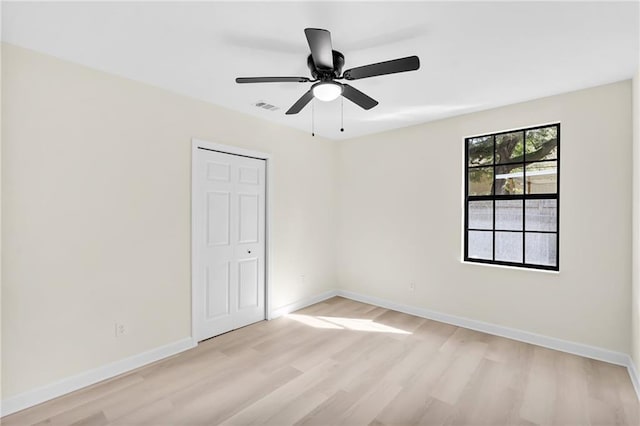 unfurnished room featuring ceiling fan and light hardwood / wood-style floors