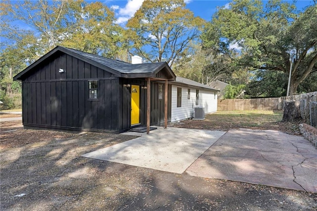 view of property exterior featuring cooling unit and a patio