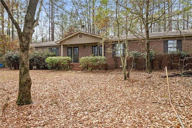 single story home with brick siding