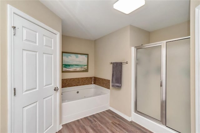 10234 Scott Plantation Dr N, Mobile, AL 36695 - bathroom with a stall shower, wood finished floors, and a bath