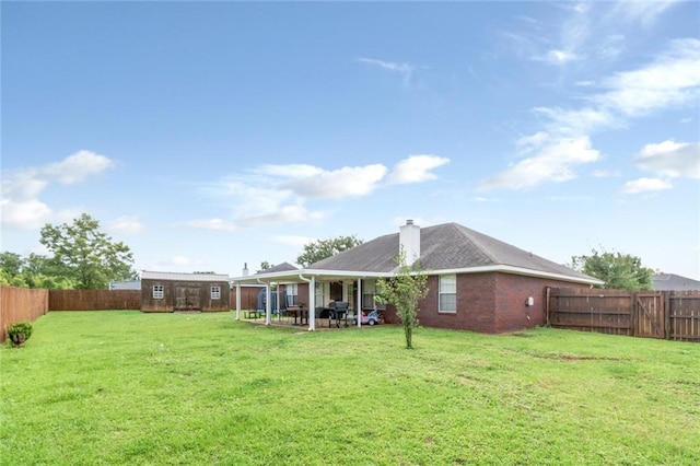 10234 Scott Plantation Dr N, Mobile, AL 36695 - fenced backyard with a patio area and an outdoor structure