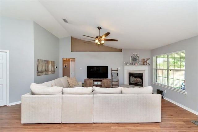 10234 Scott Plantation Dr N, Mobile, AL 36695 - living area featuring ceiling fan, a fireplace, light wood-style flooring, and lofted ceiling
