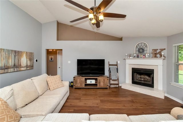 10234 Scott Plantation Dr N, Mobile, AL 36695 - living room featuring a ceiling fan, wood finished floors, a tiled fireplace, and vaulted ceiling