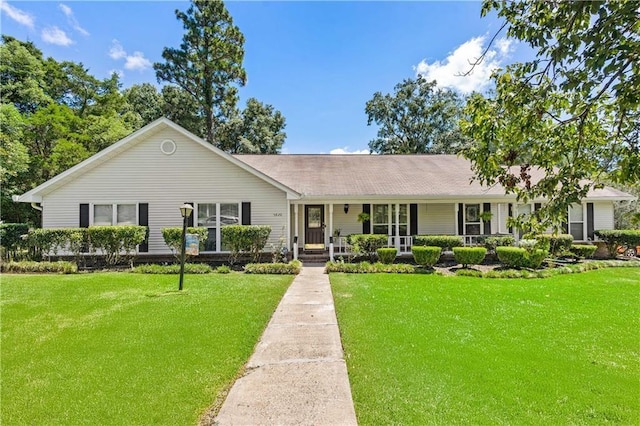 ranch-style house with a porch and a front yard