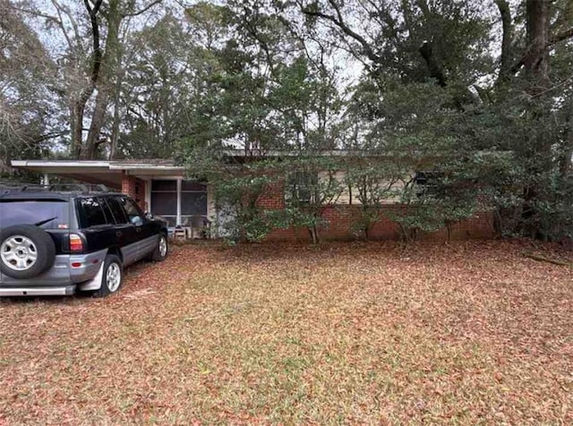 view of front of property featuring a carport