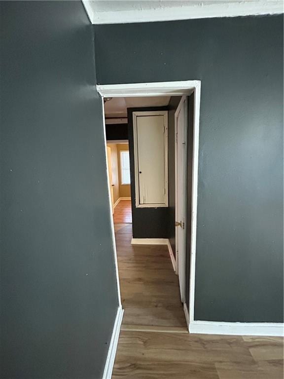 corridor featuring hardwood / wood-style floors