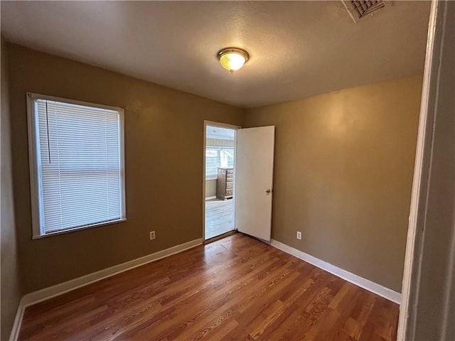 empty room featuring hardwood / wood-style flooring