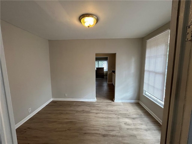 empty room featuring wood-type flooring