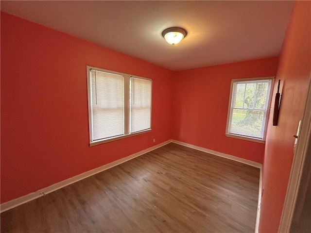 empty room featuring hardwood / wood-style flooring