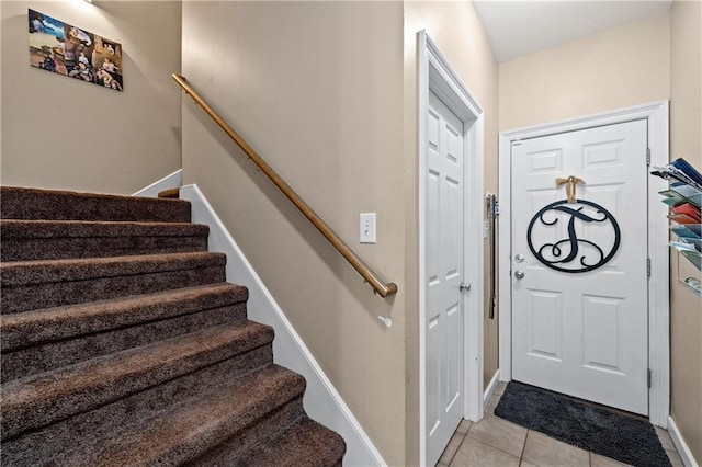 9791 Aspen Cir, Daphne, AL 36527 - foyer with light tile patterned floors and stairs