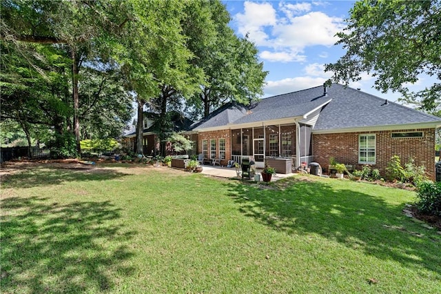 9791 Aspen Cir, Daphne, AL 36527 - rear view of property featuring brick siding, a patio, a sunroom, and a shingled roof