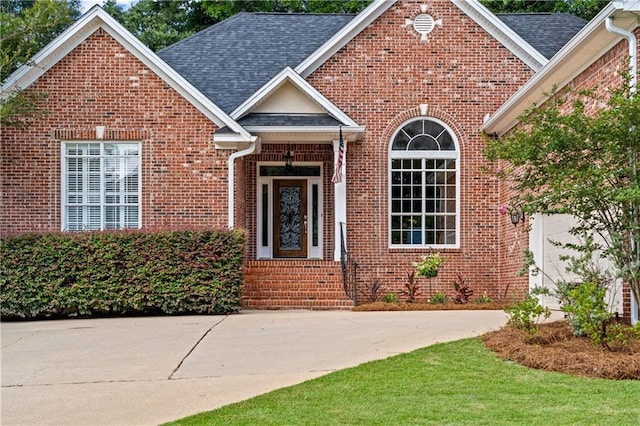 9791 Aspen Cir, Daphne, AL 36527 - property entrance with brick siding and roof with shingles