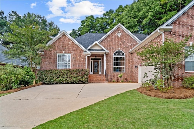 9791 Aspen Cir, Daphne, AL 36527 - view of front of property featuring driveway, brick siding, a garage, and a front yard