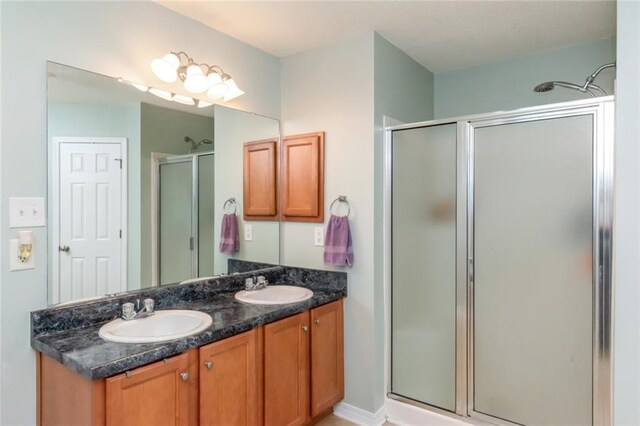 bathroom featuring vanity and walk in shower